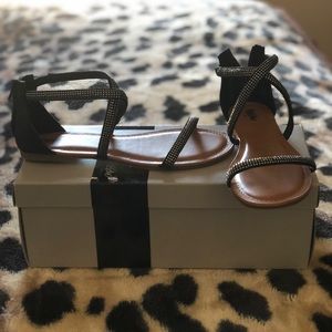 Black sandals with rhinestones.